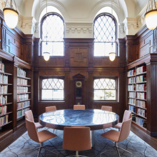 Oak Room interior showing a round table, chairs, and bookshelves