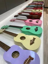 a row of multi-colored ukuleles
