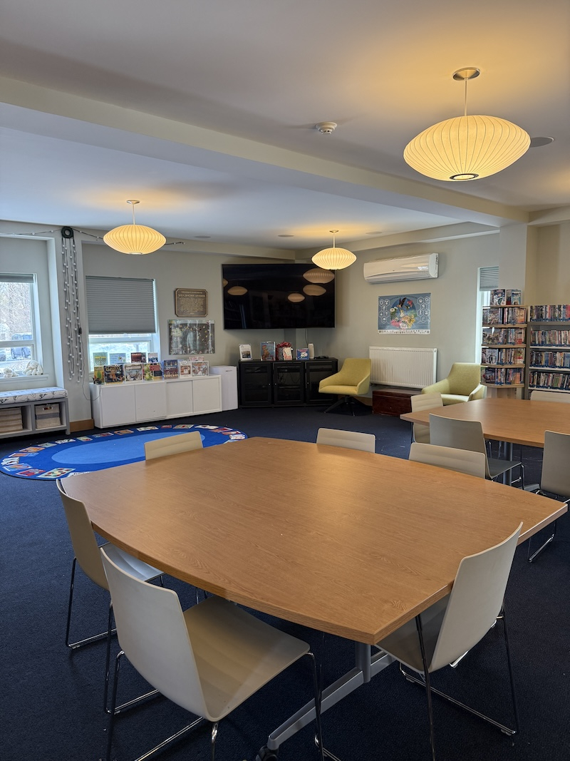 conference room with tables and large screen