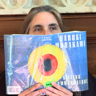 Jennifer Schwartz with book over face