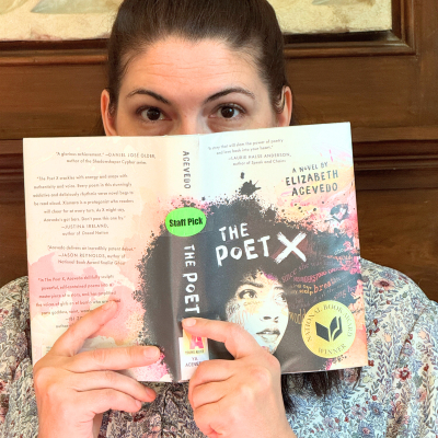 Julia Hobart with The Poet X over face