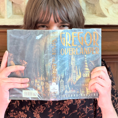 Kyla DeRisi with book over face